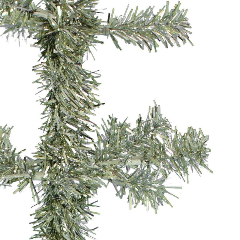 Upclose look at the silver tinsel twig branches made on a wire branch.
