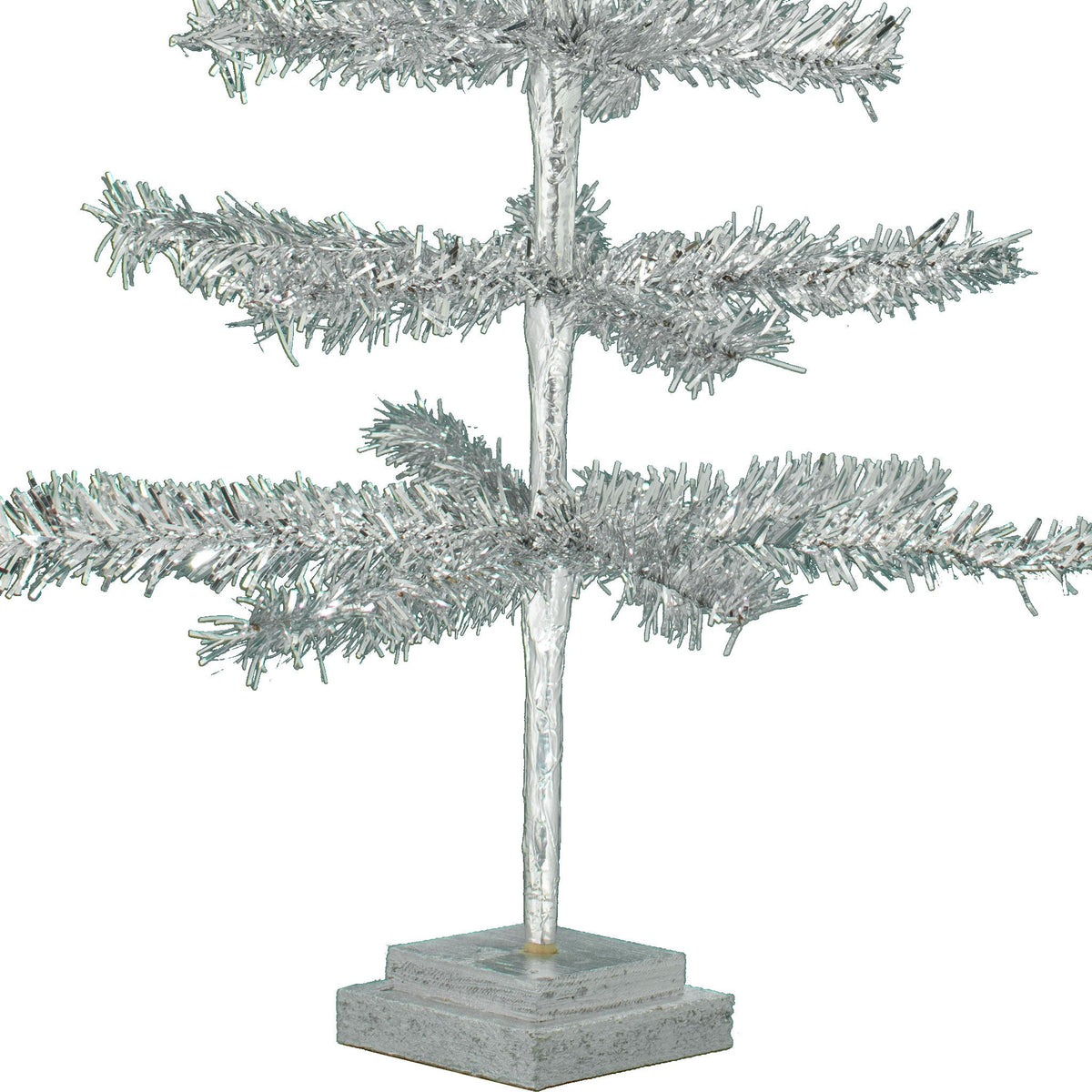Stand Included: A double-tiered wooden base comes painted in a special color to match your tree.  Stands are made from recycled CDX Plywood with rough edges and cuts.  