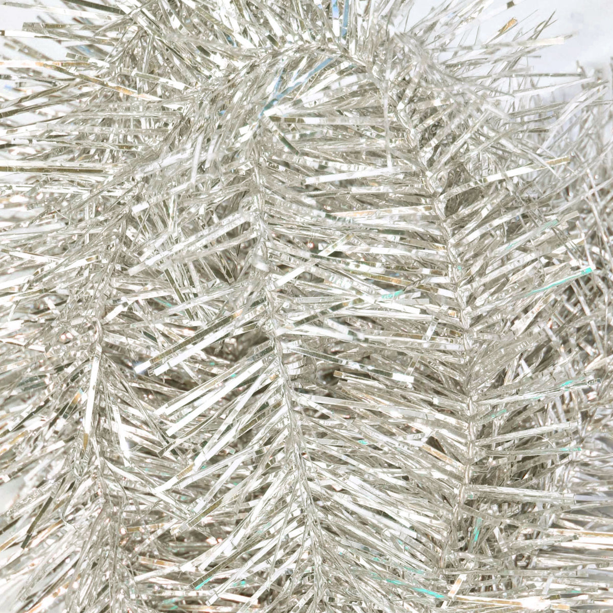 A photo of a bundle of 3in diameter Antique Silver Tinsel Garland upclose