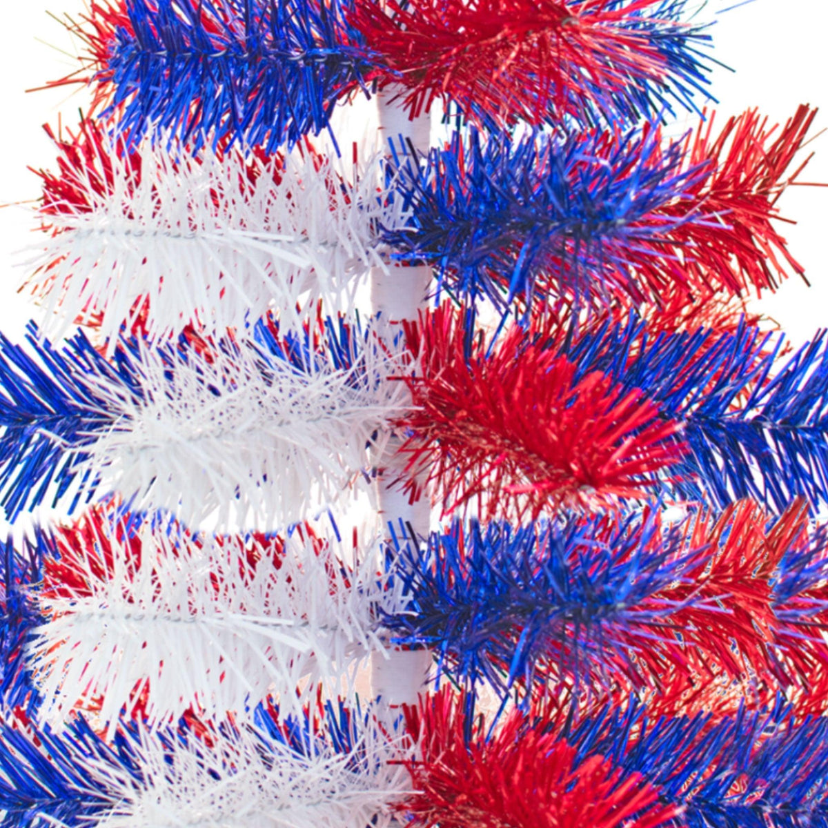 Middle branches of the 24in Tall Red White and Blue Mixed Tinsel Christmas Tree on sale at leedisplay.com.