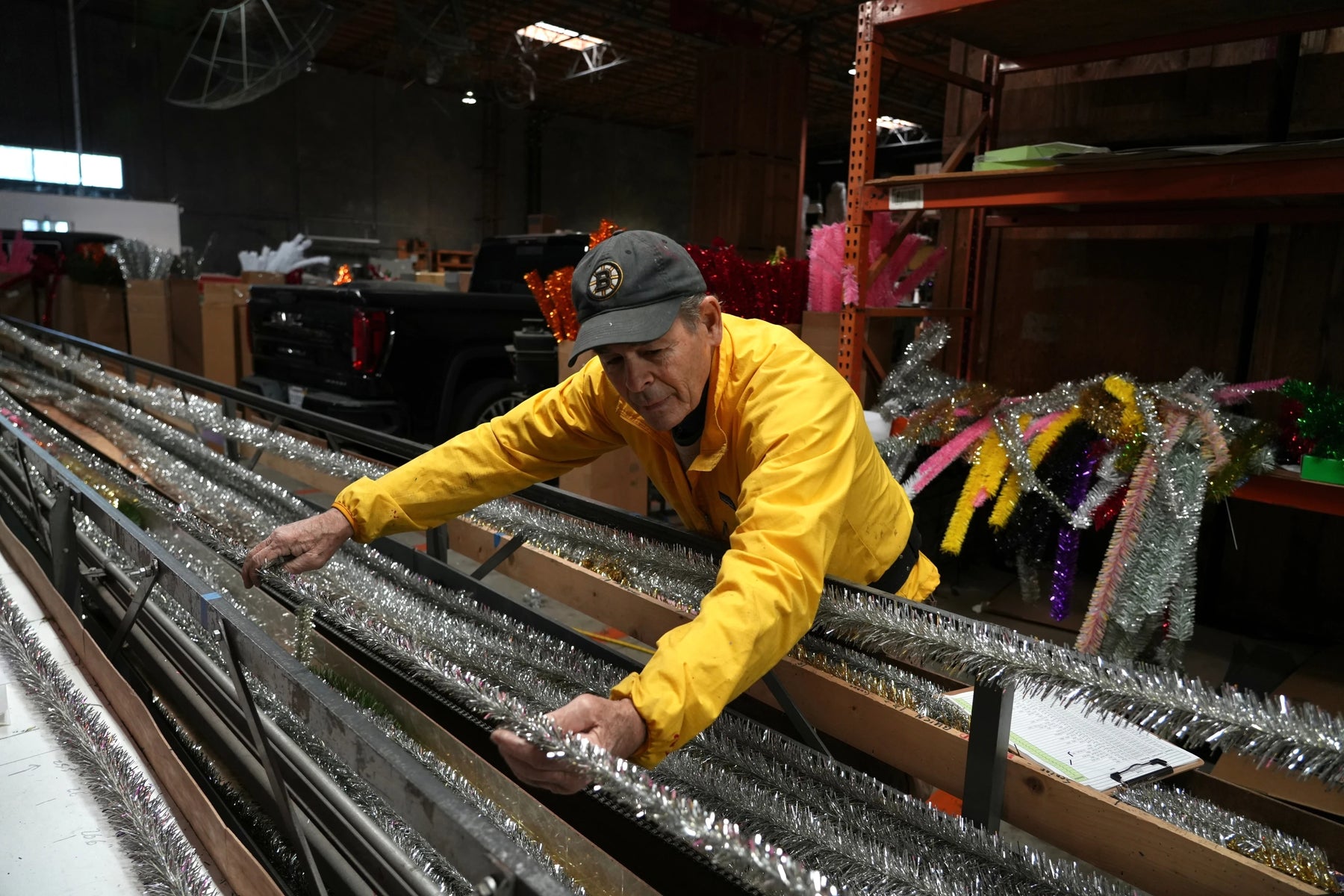 Mark Latino making tinsel garland from our custom built brush machine for the Associated Press story.