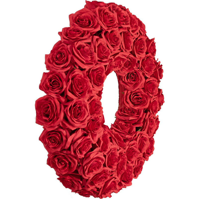 A side angle of the Red Rose Wreath showing the 3-dimensional round shape of the wreath.  The wreath measures approximately 4 inches in depth from the front to the backside.