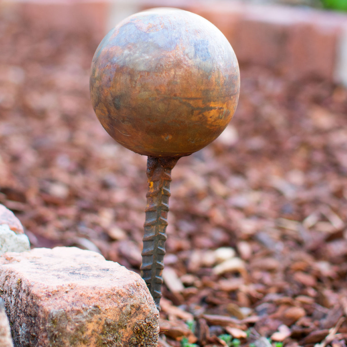 Rusty Garden Hose Stakes are made with a natural solution that creates a patina rust finish.