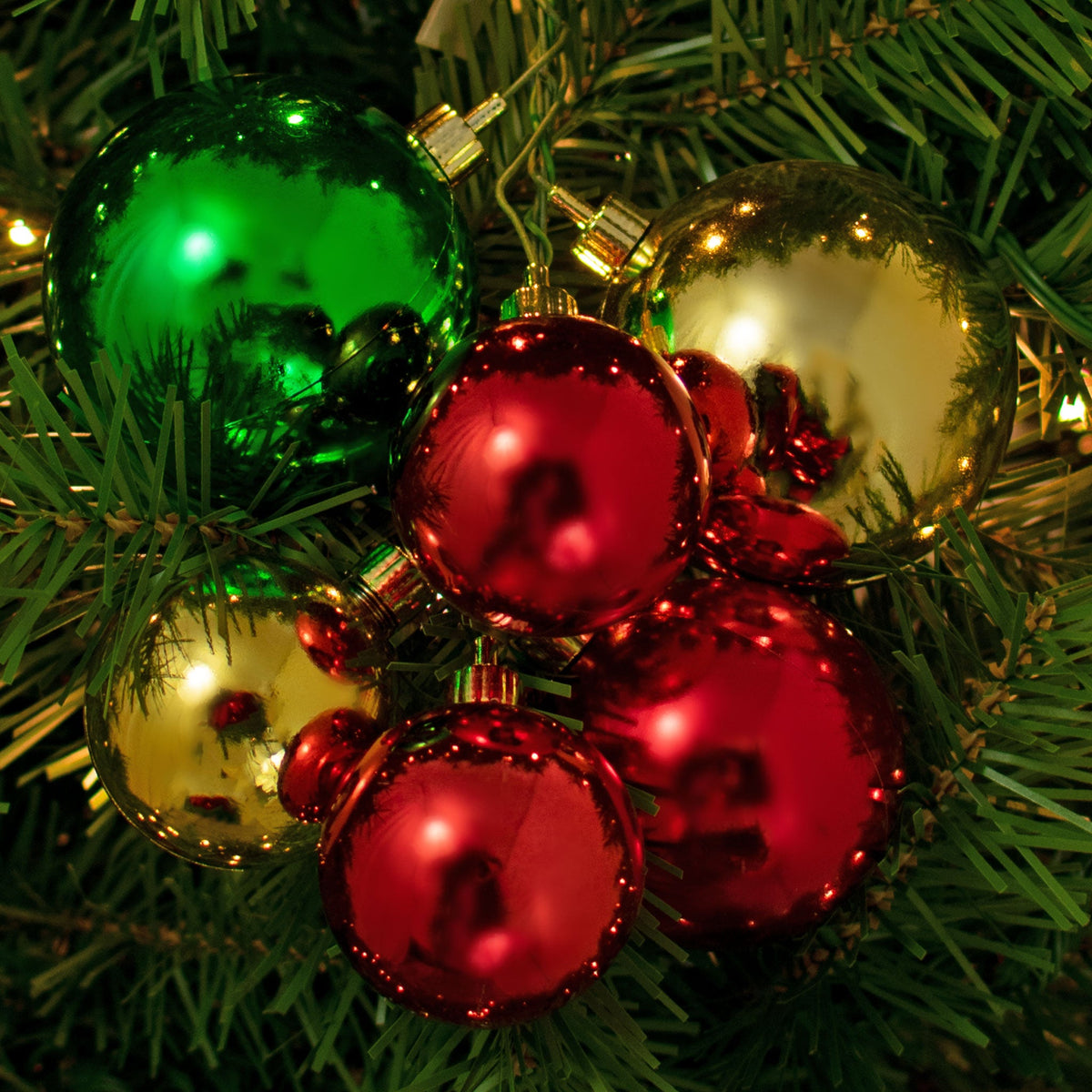 The Classic Christmas Ball Ornament Cluster with Shiny Red, Gold, and Green Ball Ornaments are perfect for decorating your Christmas Tree