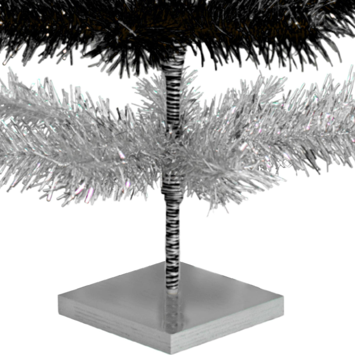 Black & Silver Layered Tinsel Christmas Trees!    Decorate for the holidays with a Shiny Black and Metallic Silver retro-style Christmas Tree.  On sale now at leedisplay.com