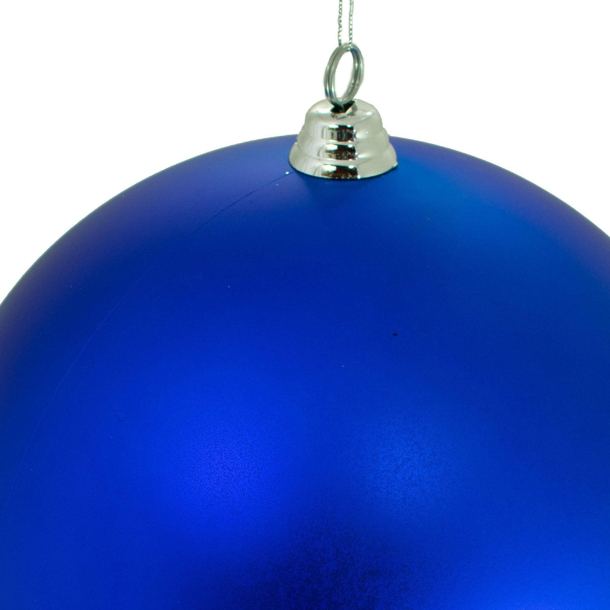 Top of the ornament with a silver cap and hanging string.