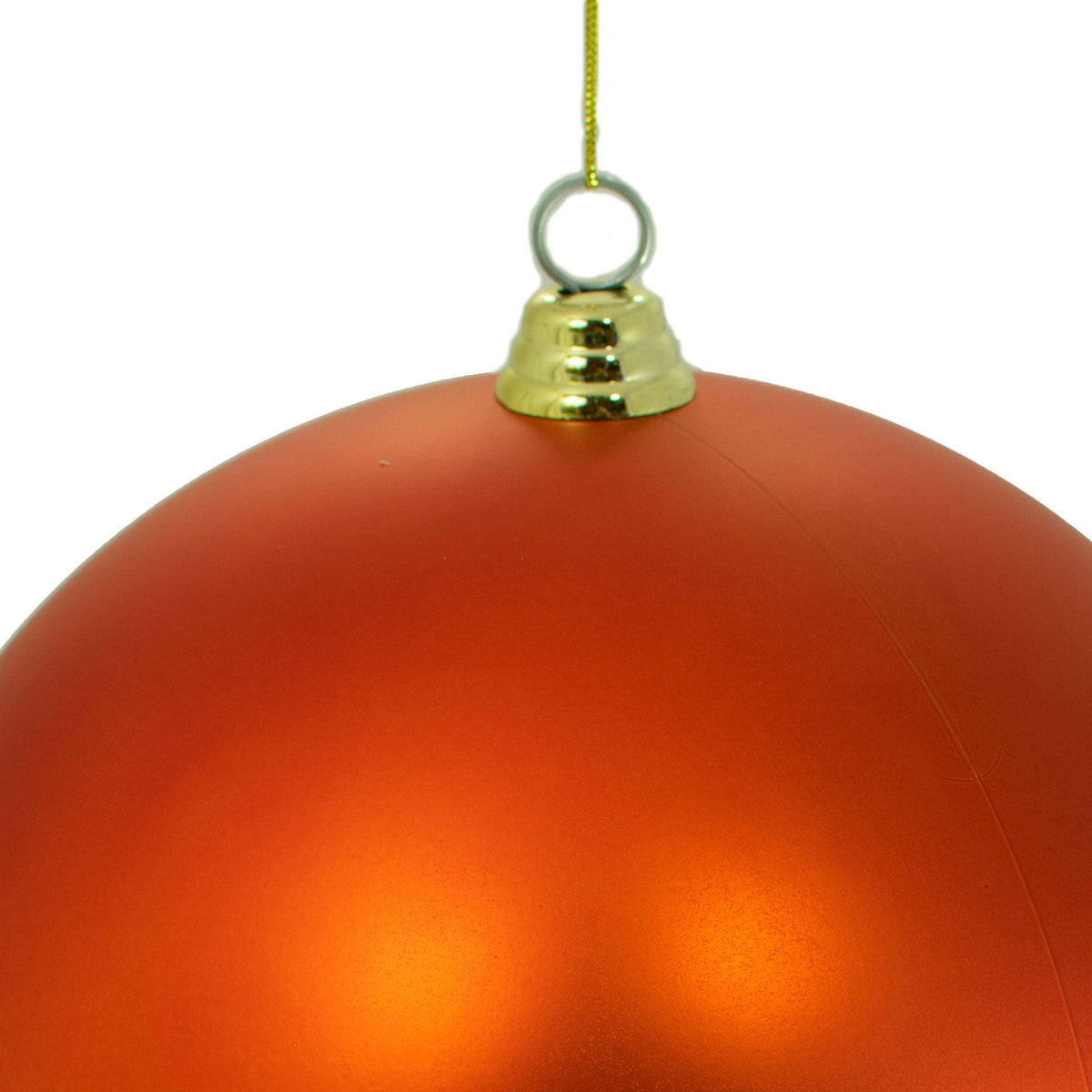 Top of the Matte Orange Ball Ornament with a gold plastic cap and hanging string.