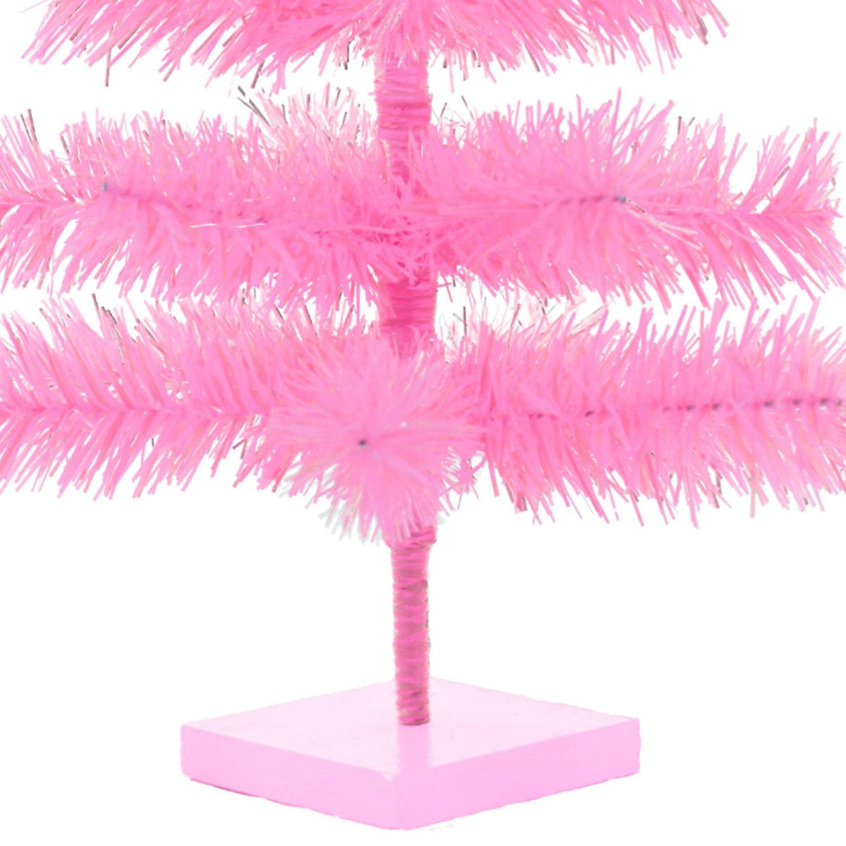 18 inch trees come with a wooden single tiered base painted pink to match the color of your tree.