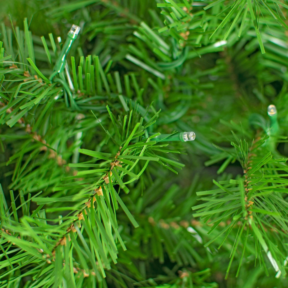 Closeup photo of the LED Lights on some of the branches. 10FT Premier Pine Tree Pre-Lit with LED Lights.  On sale from leedisplay.com