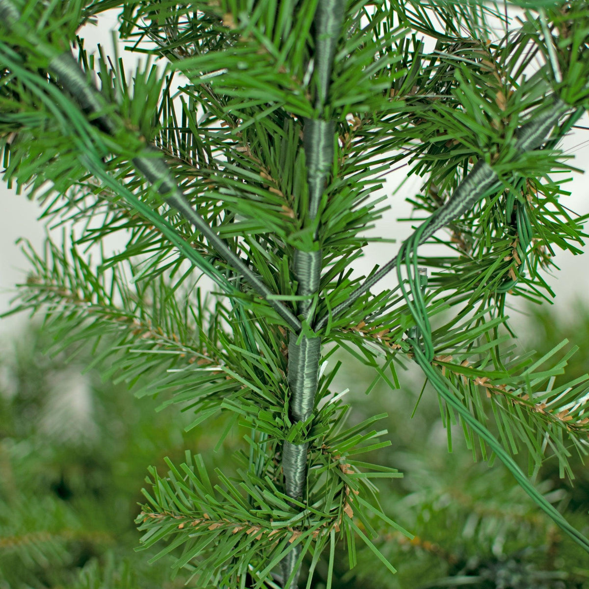 Closeup of the triple spray branch design.  Each branch comes with 3 sprays and multiple tips. 10FT Premier Pine Tree Pre-Lit with LED Lights.  On sale from leedisplay.com